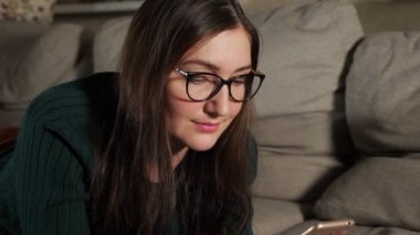 Woman with a phone and a bank card.