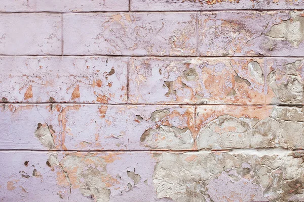 Vecchio sfondo della parete incrinato, la texture vernice lilla e arancione — Foto Stock