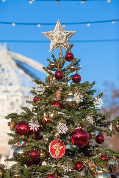 Decorated outdoor Christmas Tree with beautiful festive arrangem