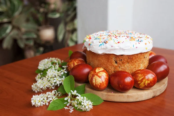 Easter symbols food - Easter cake and painted eggs. Easter orthodox sweet bread, kulich and colorful quail eggs. Holidays breakfast concept. Traditional orthodox christian easter food.