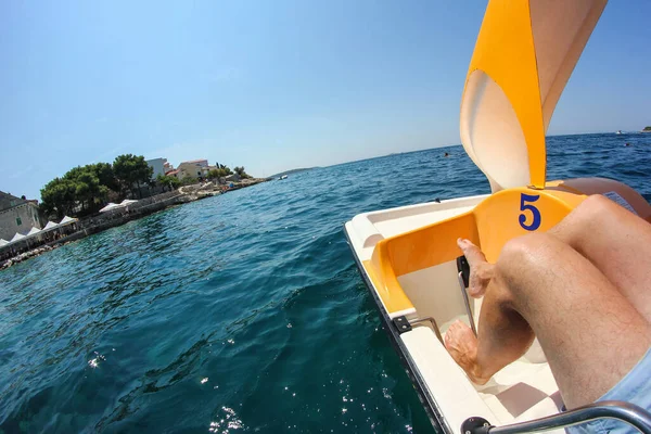 A picture from a rented paddle boat floating on the sea near the Croatian shore. Sunny day and great relaxation during the holiday.