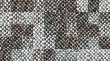 Gri kot elementlerinden yapılmış mozaik dokuların soyut videosu. Arkaplan tasarımı. Arkaplan. Duvar Kağıdı.