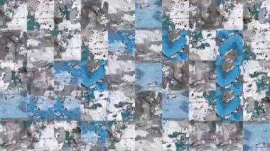 Beton duvardaki elementlerin beyaz, mavi, yeşil, yırtık pırtık boyalar içindeki mozaik dokularının soyut videosu. Arkaplan tasarımı. Arkaplan. Duvar Kağıdı.