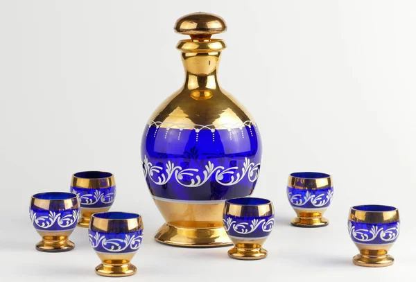 Decorative bottle and glasses isolated — Stock Photo, Image