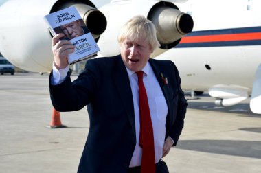 Boris Johnson, Secretary of State for Foreign and Commonwealth Affairs with his book, The Churchill Factor clipart