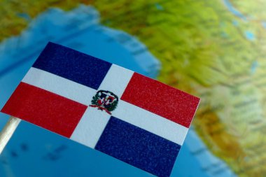 Bir arka plan makro olarak bir harita ile Dominik Cumhuriyeti bayrağı