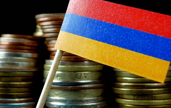 Armenia flag waving with stack of money coins macro — Stock Photo, Image