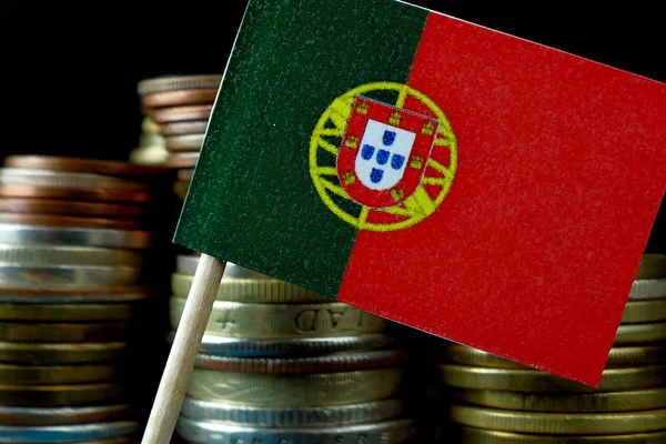 Portugal flag waving with stack of money coins macro — Stock Photo, Image