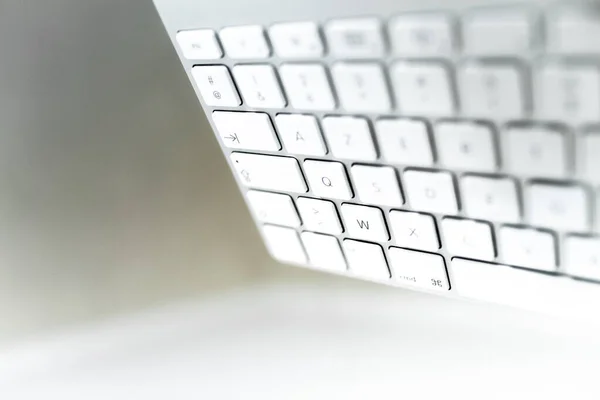 Close-up of computer keyboard on white background.