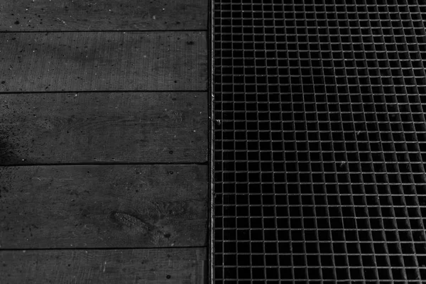 Black and white abstract background of metal floor.