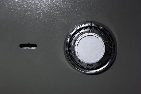 Close-up of mechanical code lock, of metal safe.