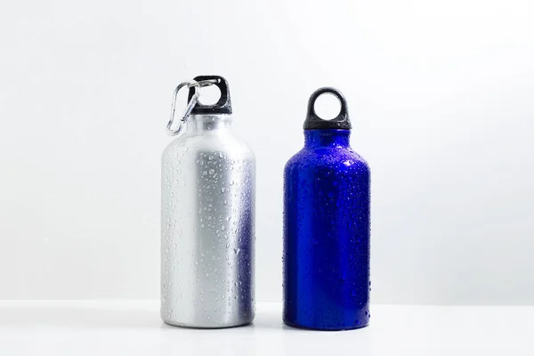 Steel and aluminum, eco thermo bottles for water, on white background.