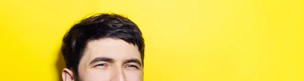 Close Smiling Eyes Asian Guy Panoramic Portrait Yellow Background Copy — Stock Photo, Image