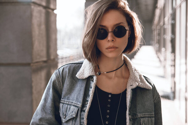 Beautiful and stylish girl in sunglasses on a sunny day