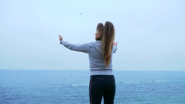 Mature Woman Praying Edge Cliff Sea — Stock Video