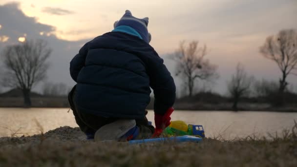 Cute Child Playing Alone Toy Trucks Vehicles Sand Beach River — Wideo stockowe