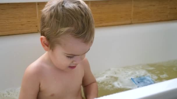 Happy Cute Child Washes Himself Shampoo Washcloth Bathtub Bathes Bathroom — Stock Video