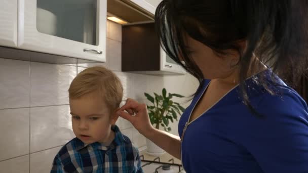 Young Mother Strokes Son Head Hair Woman Caress Child Sitting — Stock Video