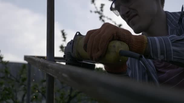 Young Man Cutting Iron Metal Construction Angle Grinder Backyard Garden — Stock Video