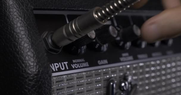 Musician Hand Plugs Cable Speaker Amplifier Turning Knobs Rocker Records — Stock Video