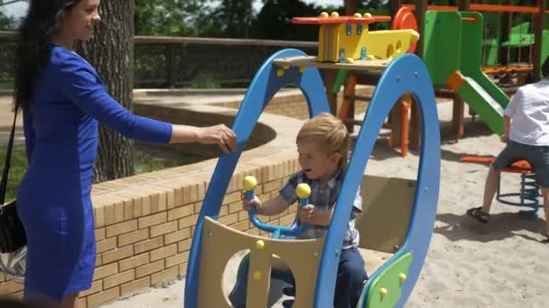 Happy Child Enjoys Attraction Ride Children Playground City Park Joyful — Stock Video