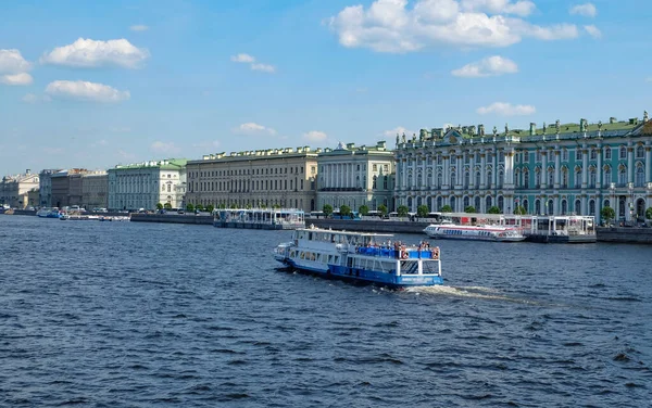 Motor ship boat cruise on the Neva River in St. Petersburg against the backdrop of the Hermitage classic buildings