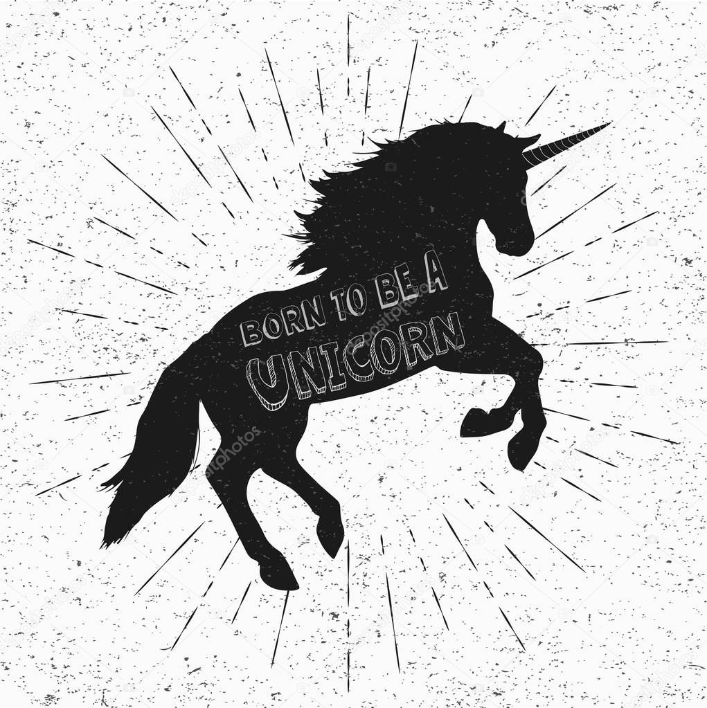 Born to be a unicorn. Vector illustration, eps10. Abstract unicorn silhouette isolated with text inside on grunge background. Black jumping fictional fairy animal.