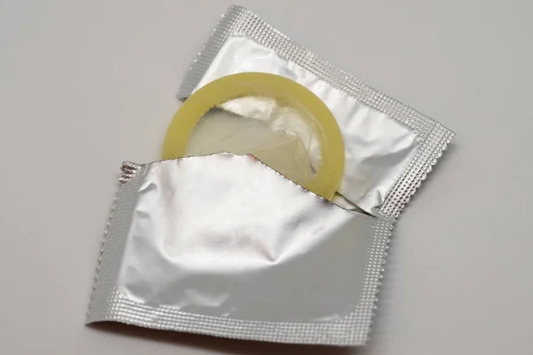 Yellow Open Condom White Background — Stock Photo, Image