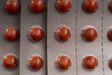 Kabarcık içinde turuncu haplar. arkaplan resmi