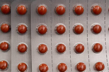 Kabarcık içinde turuncu haplar. arkaplan resmi