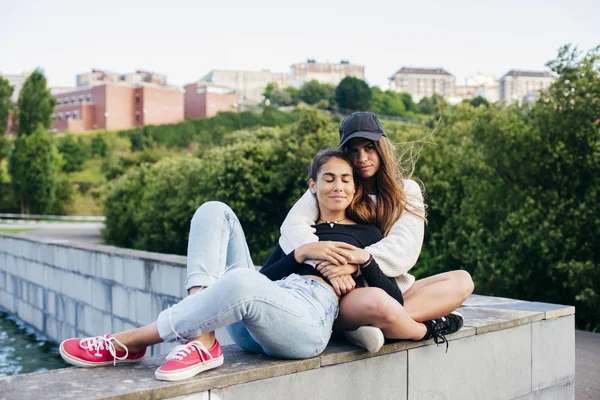 Lovely friends embracing outside — Stock Photo, Image