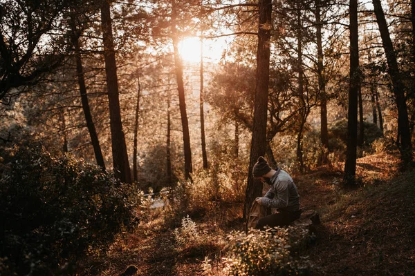 Man Sitting Forest Looking Backpack While Scenic Sunset — Stock Photo, Image