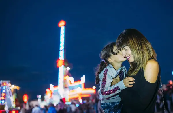 Little Girl Gives Kiss Her Mother Park Horizontal Shot — Stock Photo, Image