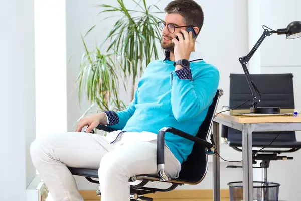 Portrait Young Businessman Sitting Chair Talking Smartphone Modern Office — Stock Photo, Image