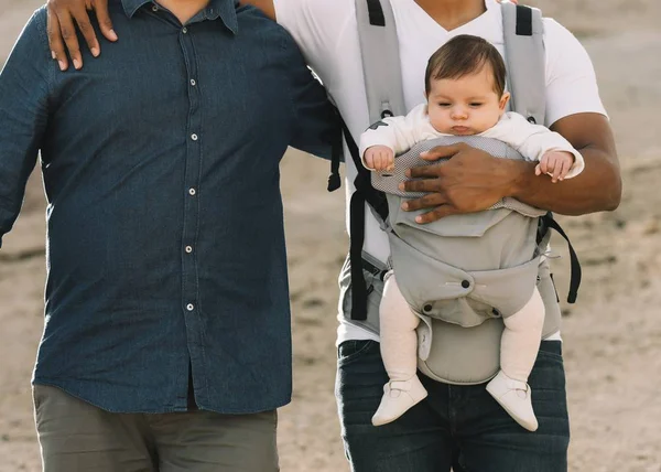 Cropped Casual Men Holding Little Calm Baby Carrier While Strolling — Stock Photo, Image