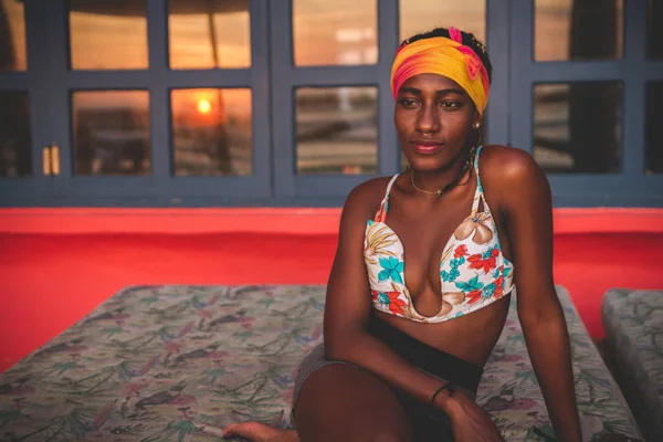 Pensive Calm African American Woman Wearing Colorful Bikini Top Headband — ストック写真