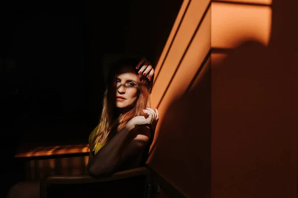 Side View Thoughtful Model Stylish Yellow Dress Makeup Sitting Chair — Stock Photo, Image