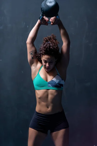 Powerful Sportswoman Bra Shorts Lifting Heavy Kettlebell Raised Arms Head — Stock Photo, Image