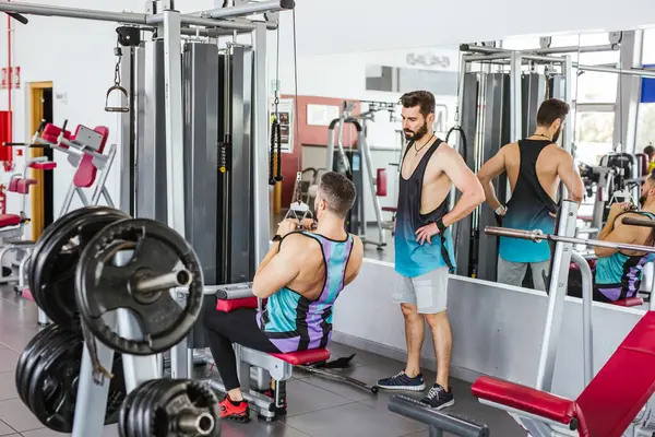 Confident Instructor Helping Diligent Client Sports Clothes Performing Exercise Weight — Stock Photo, Image