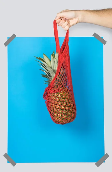 Unrecognizable Person Carrying Net Bag Ripe Pineapple Blue Rectangle Zero — Stock Photo, Image