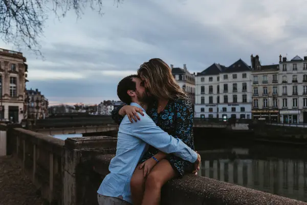 Happy Young Female Sitting Old Stone Fence Embracing Kissing Affectionate — Stock Photo, Image