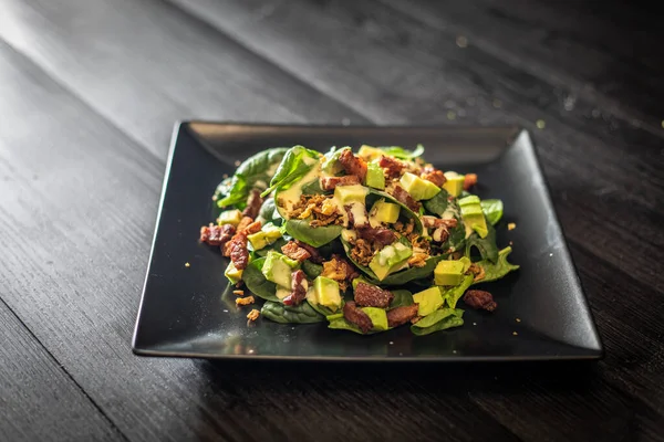 Portion Palatable Avocado Salad Fresh Spinach Walnuts Served Square Black — Stock Photo, Image