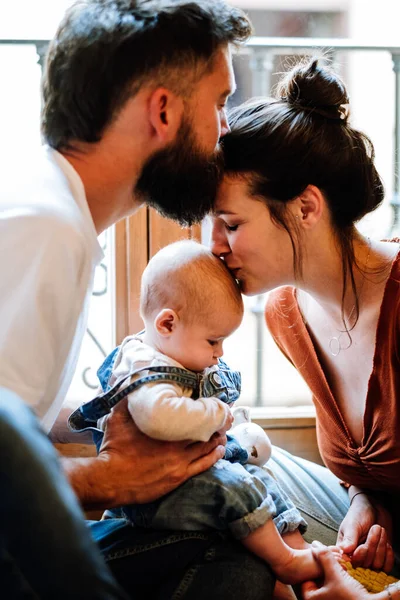 Happy Parents Kissing Baby Each Other While Sitting Window Cozy — Stock Photo, Image