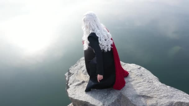 Beautiful girl in a blonde wig and a fantasy costume. — Stock Video