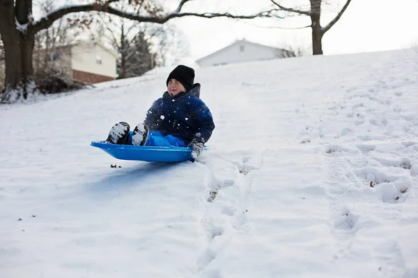 Cute little boy on sled — Stock Photo, Image