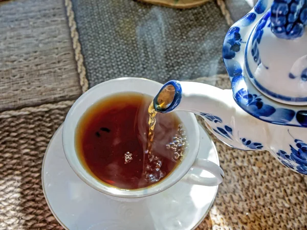 Pouring Hot Morning Tea Cup Teapot Steam Coming Stream Tea — Stock Photo, Image