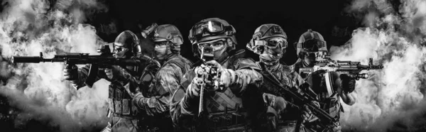 Portrait of five military men. A group of soldiers on a background of smoke. The concept of military operations, special operations, paintball. Mixed media