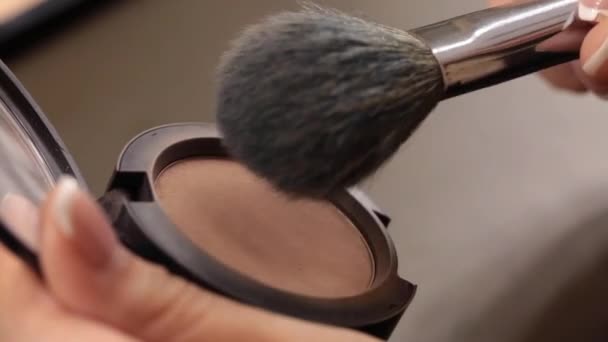 Close up of makeup brush moving over eye shadows — Stock Video