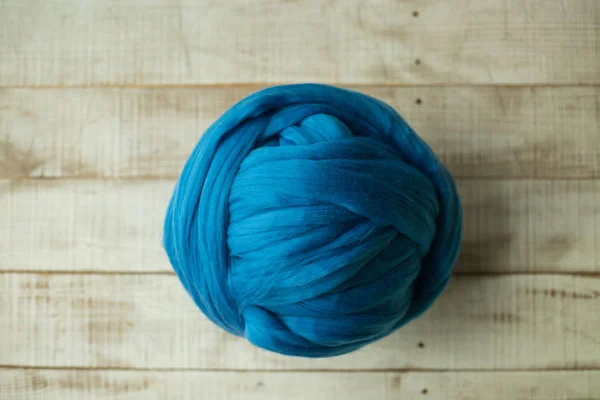 Blue merino wool ball on wooden background — Stock Photo, Image