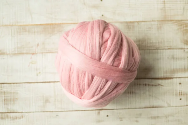 Pink merino wool ball on wooden background — Stock Photo, Image